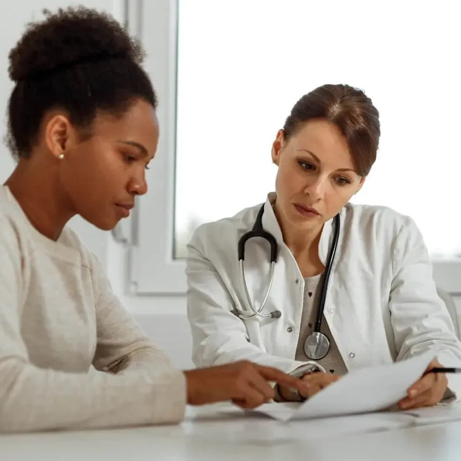 DNP Nurse Practitioner Consulting Diagnosis with Adult Patient
